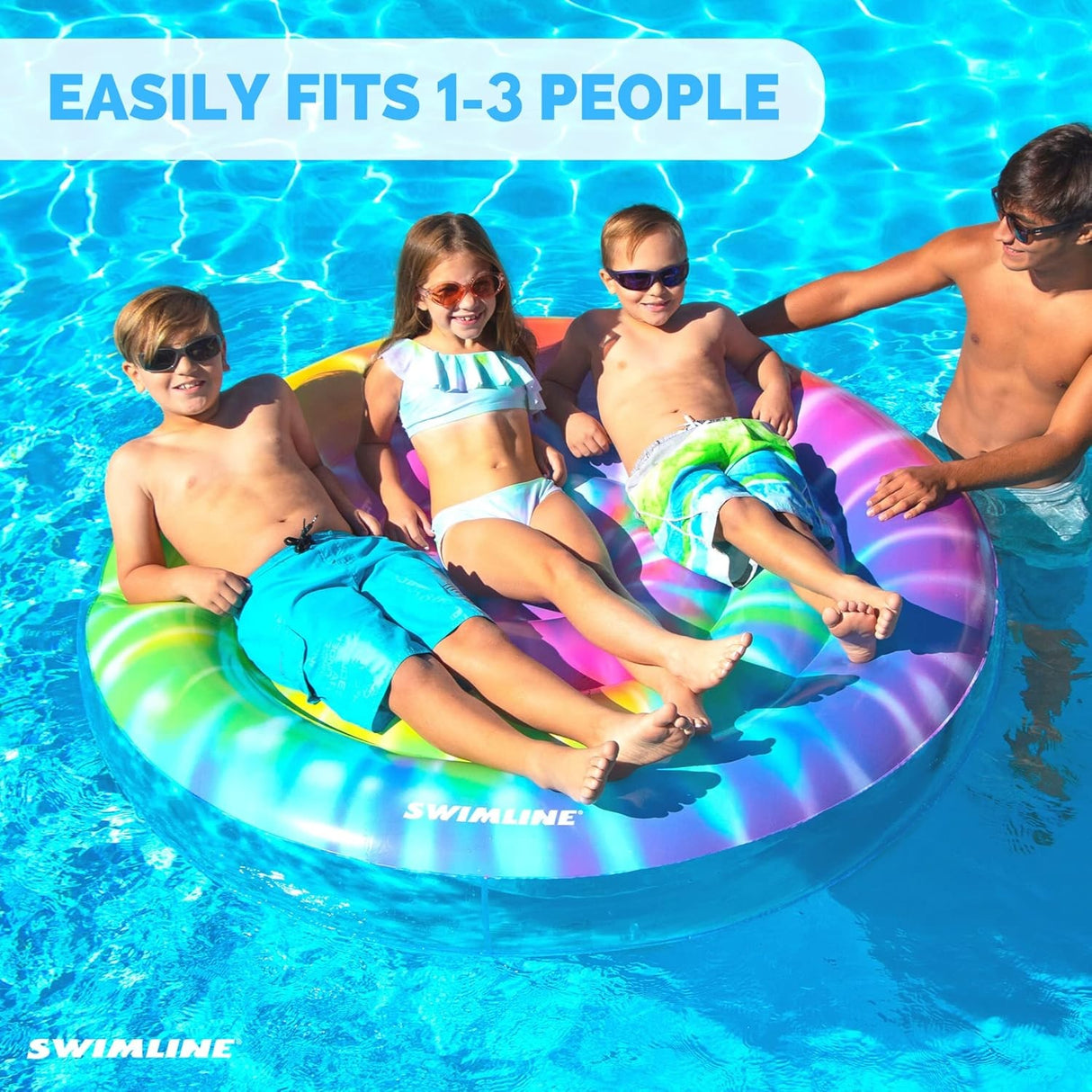 This is a lifestyle image showing three kids laying on the pool inflatable together in the pool. It reads "Easily fits 1-3 people."