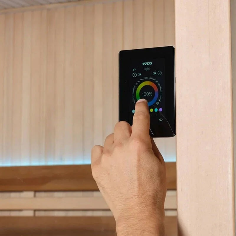 This image shows someone controlling the temperature and the lights inside the sauna.