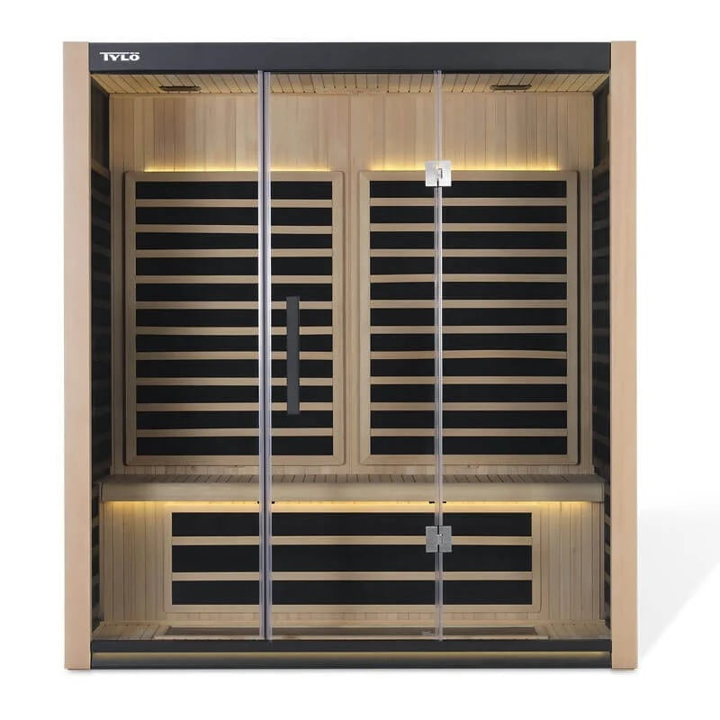 A light brown, 3-person sauna with yellow lights on inside.