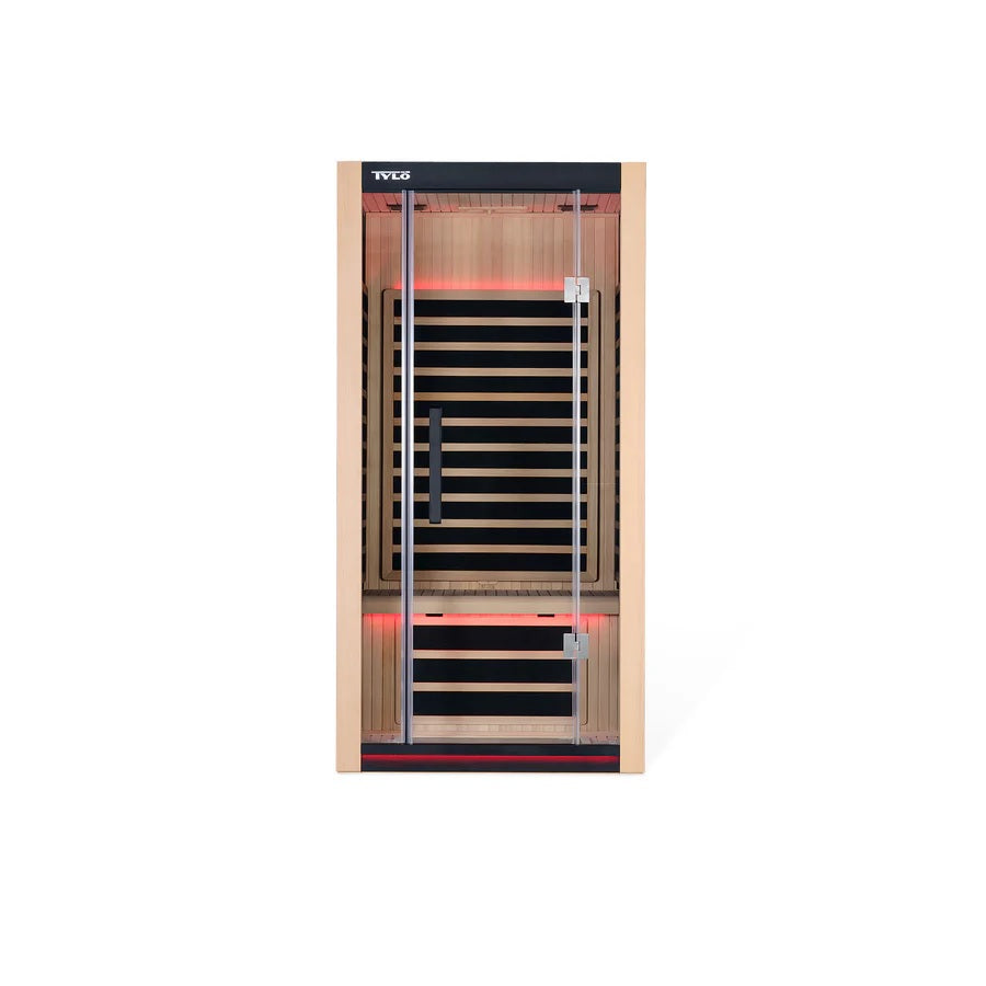 Light brown colored home sauna that fits 1 person. The lights inside the sauna can be changed. The lights in this image are red.