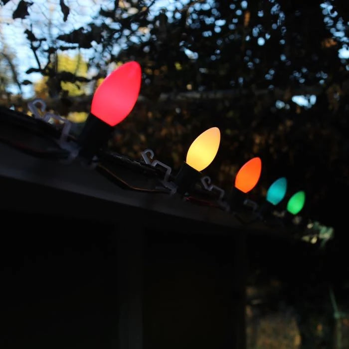 This is a lifestyle image showing the ceramic multi-colored lights on the roof of a house.
