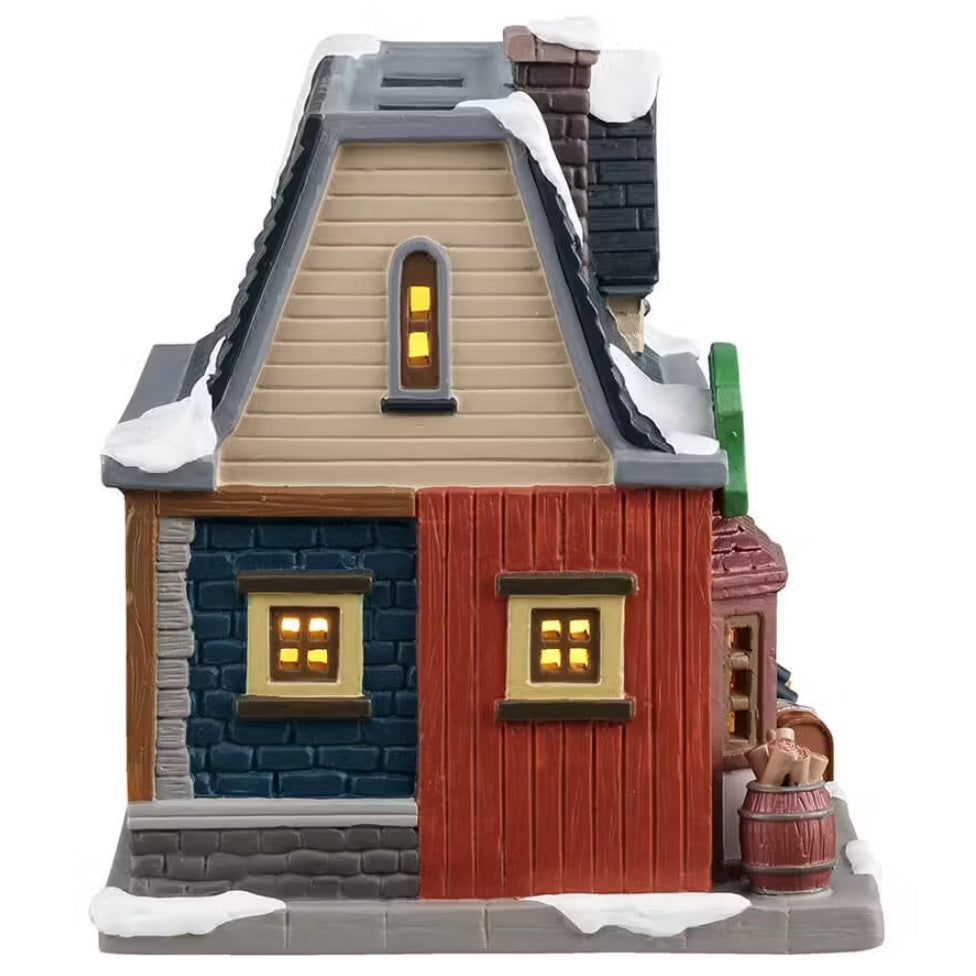 This is the side of the building. The top part is tan colored, the bottom part is blue and gray bricks and red panels.