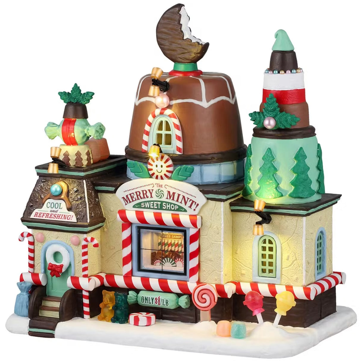 This is a Lemax lighted building designed to look like it's made out of desserts. There are frosting accents, cookies, gummy bears, candy canes, lollipops and peppermint candies. Inside the window, you can see candies being made.