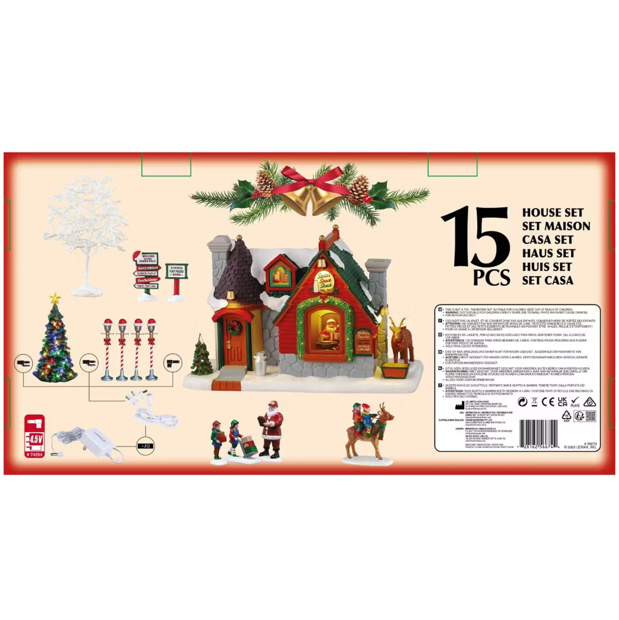This is the back of the box showing all the pieces that come with it. There are two trees, two village signs, four lamp posts, a building, four figurines and two adaptors.
