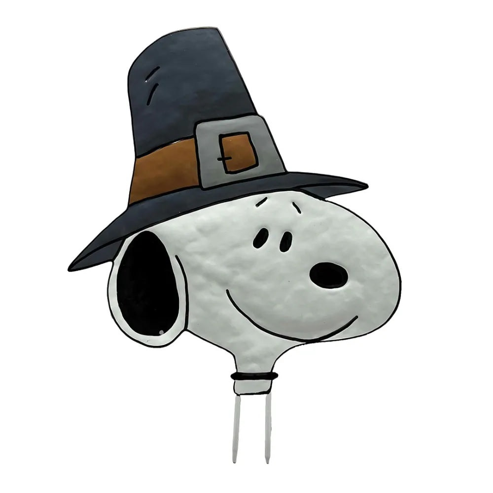 This is an up close view of the pumpkin press-in decoration. Designed to look like the black and white beagle from the Peanuts cartoons: Snoopy. He's wearing a black and brown pilgrim hat.