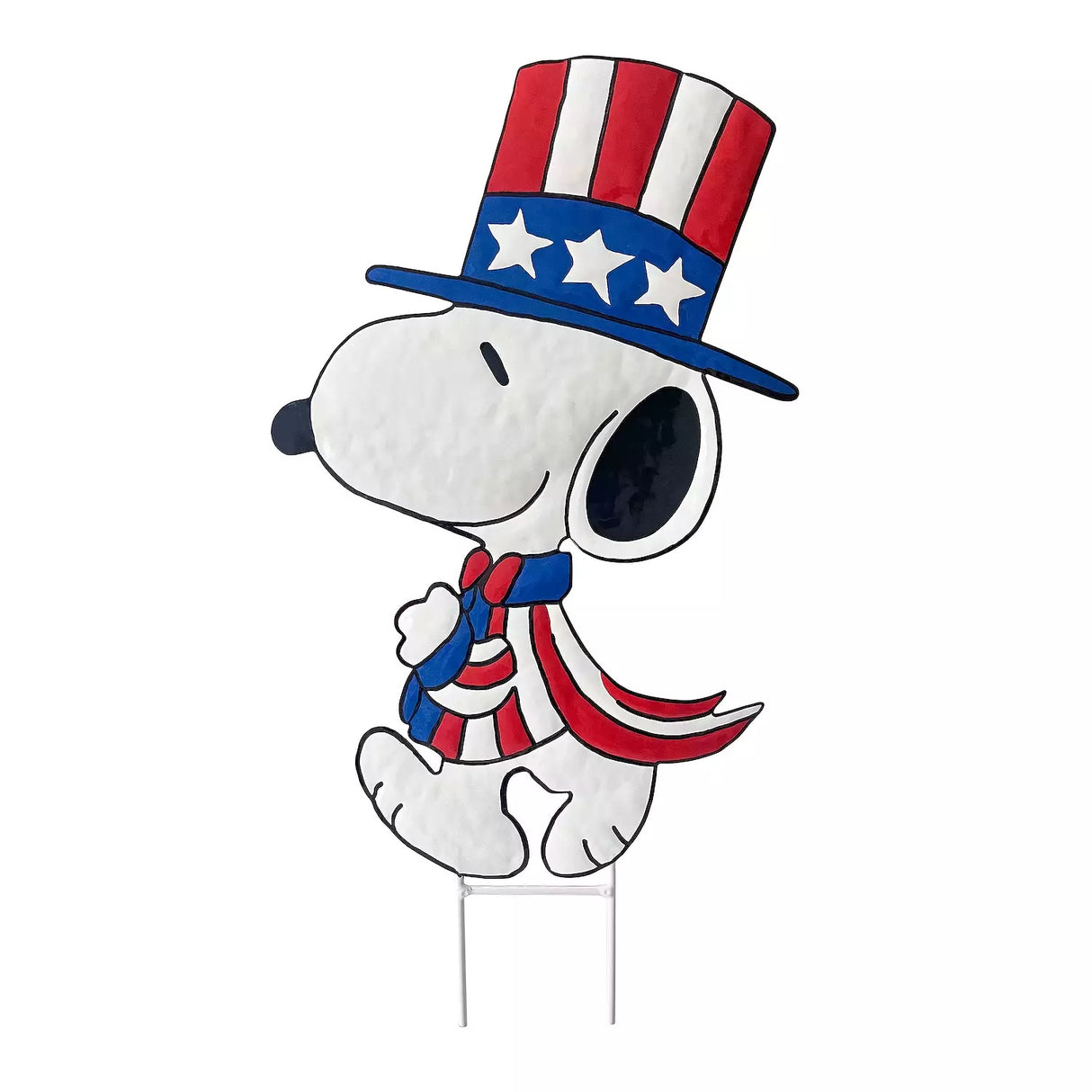 This image shows this decorative garden stake shaped like the famous Peanuts character, Snoopy. He's wearing a red, white and blue top hat and suit.