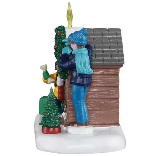 This is a different angle of this table accent. The boy is wearing a blue winter hat, a teal scarf and gloves, a dark blue jacket, blue jeans and brown shoes.