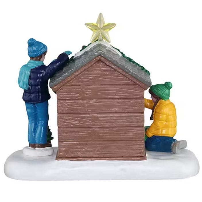 This is the back of this table accent. You see the back of the boy, the dog house and the girl.