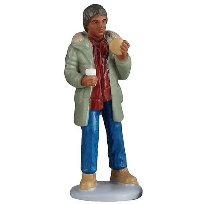 This person is wearing a gray winter hat, a light green jacket, red scarf, blue pants and brown shoes. He's holding a hamburger in one hand and a drink in the other.