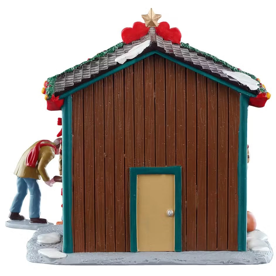 This is the back of the booth. There's a brown door with a silver doorknob.