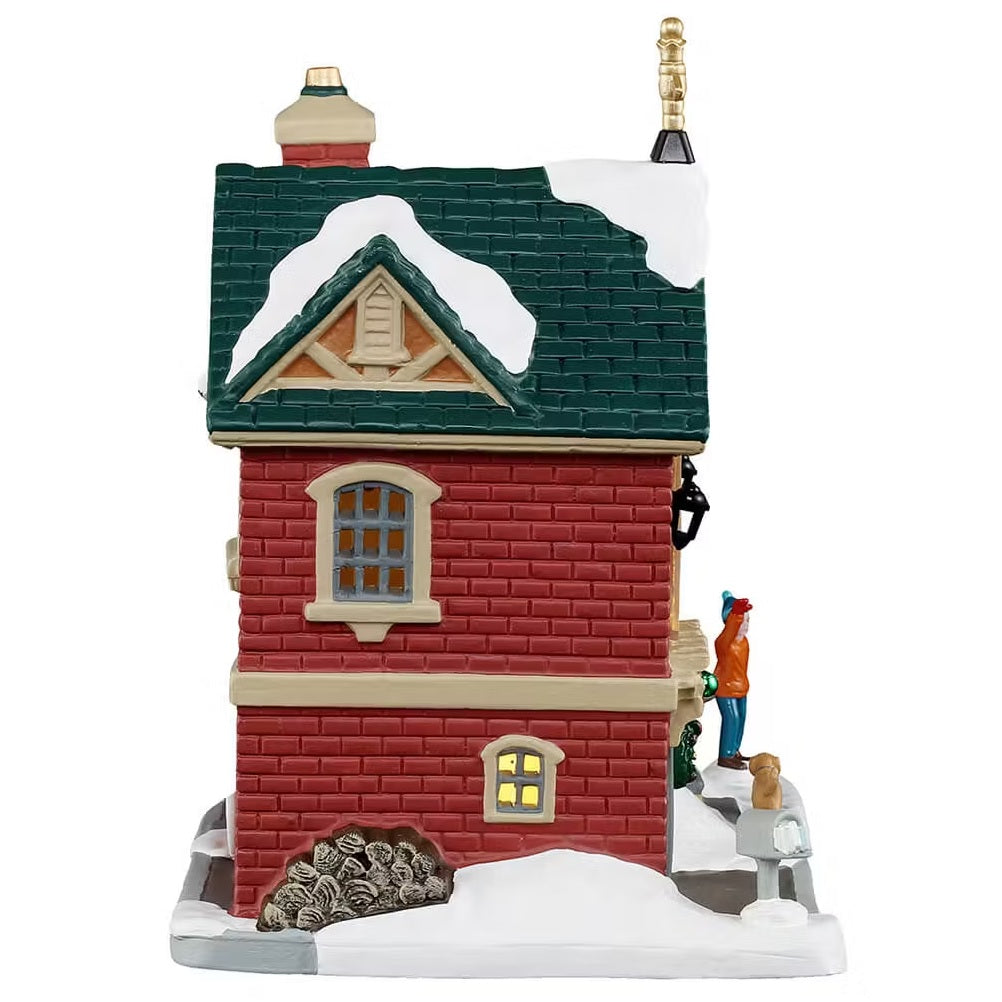 This is the other side of the building. There's a stack of firewood and you can see the gray mailbox.