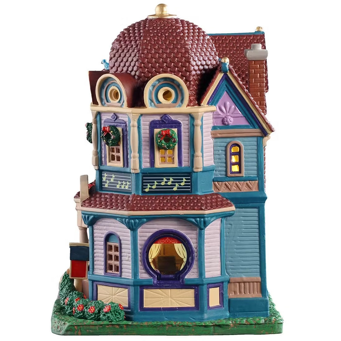 This is the other side of the building. The roof is rounded. The windows are decorated with wreaths. There's a large circular window on the first floor.