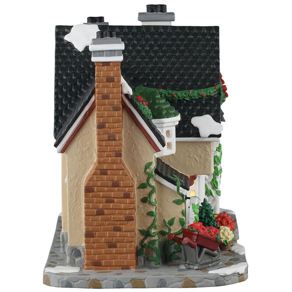 This is the side of the building. There's a brick chimney and ivy growing up the walls.