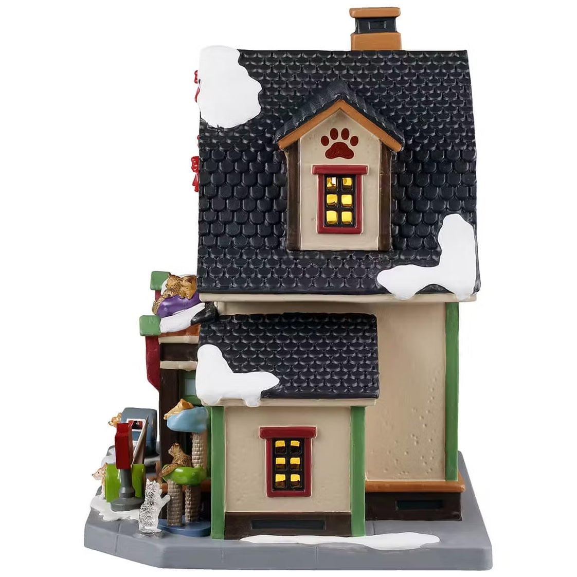 This is the side of the building. You can see the cats laying in the cat tower. There's a white cat scratching on the cat tower too.