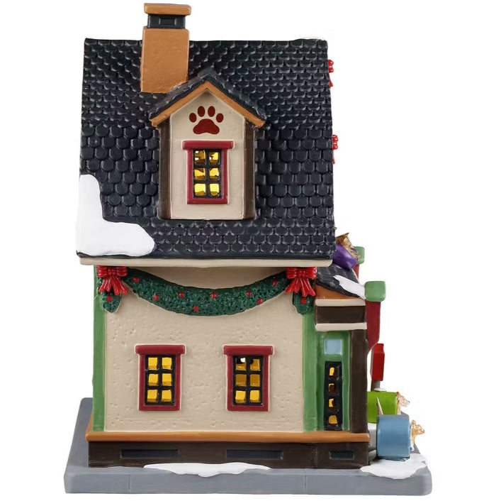 This is the other side of the building. There are four windows with light shining through.