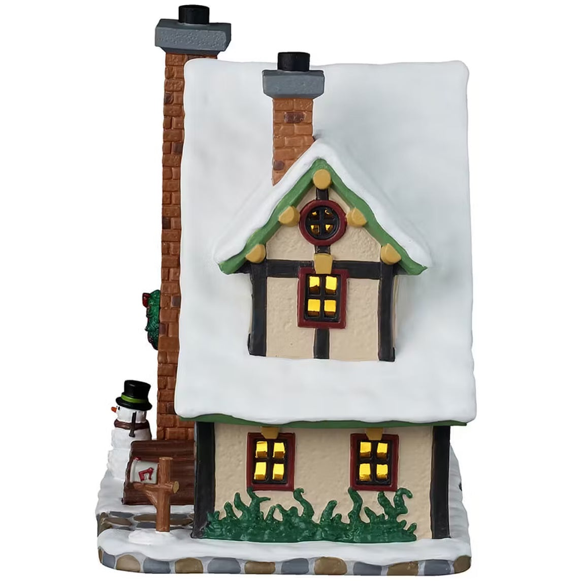 This is the other side of the building. There are four windows with light shining through. There's grass peeking out from the snow and a silver shovel leaning up against the building.