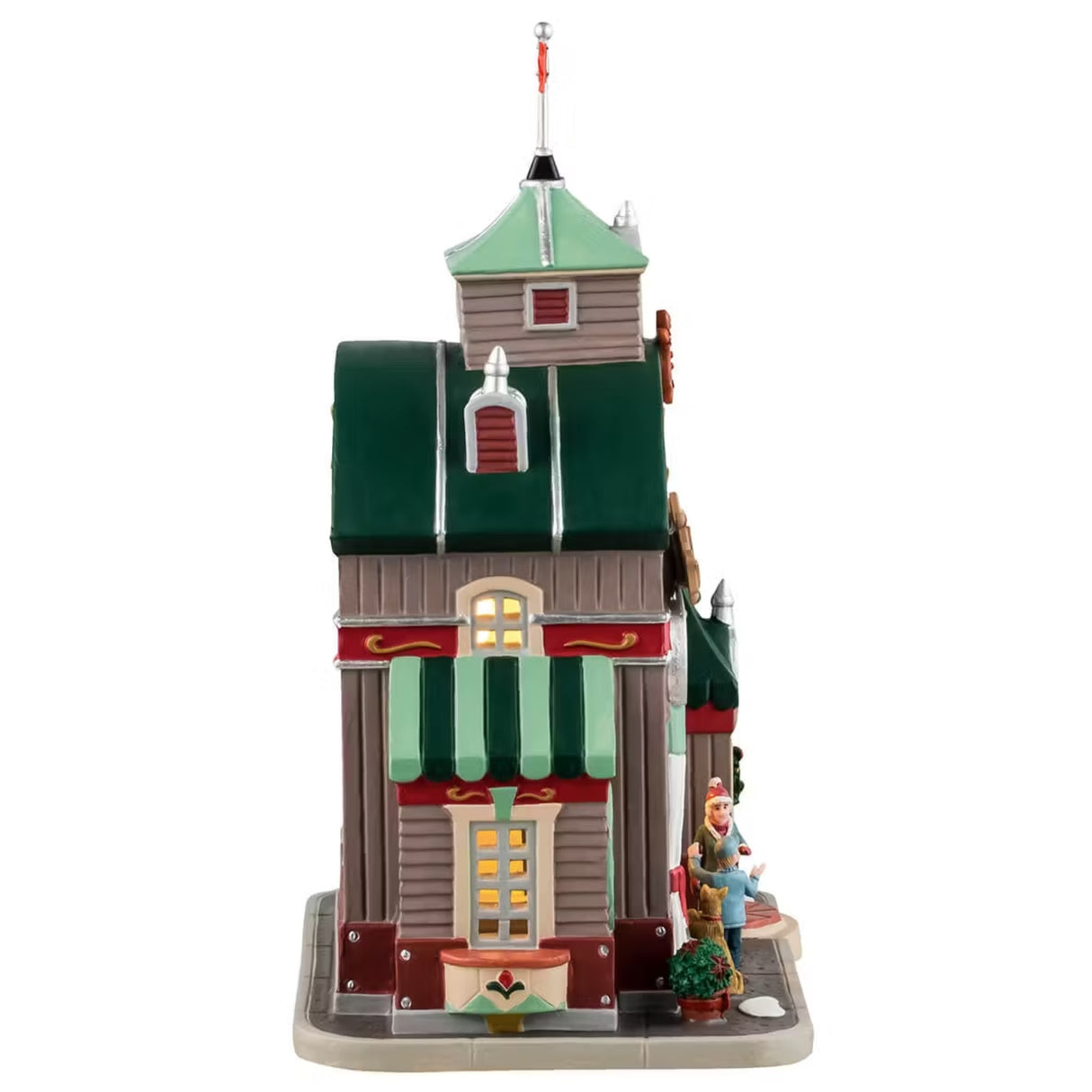 This is the other side of the building. You can see lights coming through the windows and the two people and the dog at the counter.