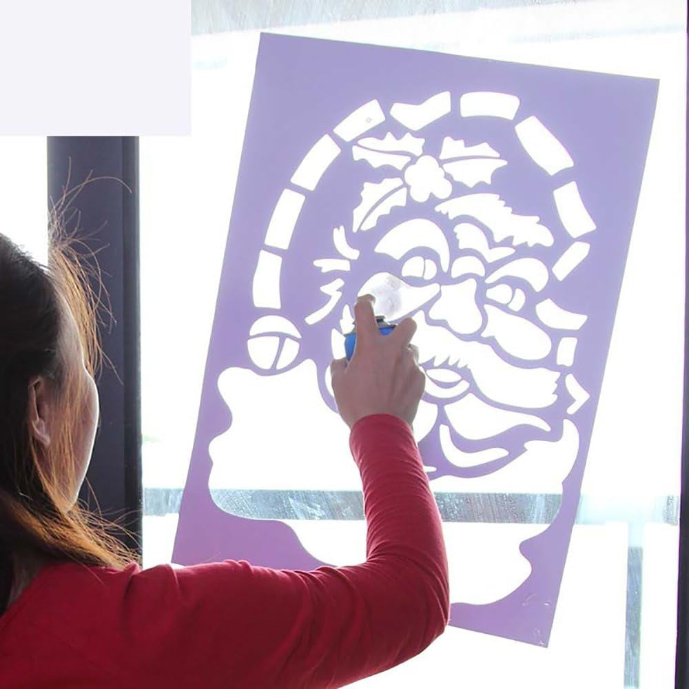 This image shows a person putting a Santa stencil on a window and spraying the artificial snow in it.