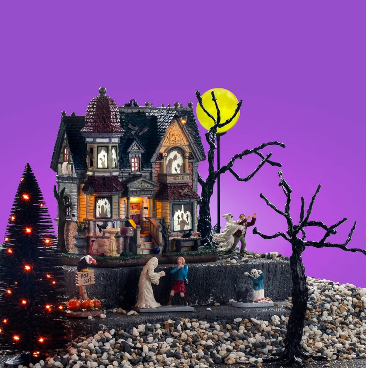 This image shows the House Set on display with a purple background. This image can be used as inspiration for how to set these items.