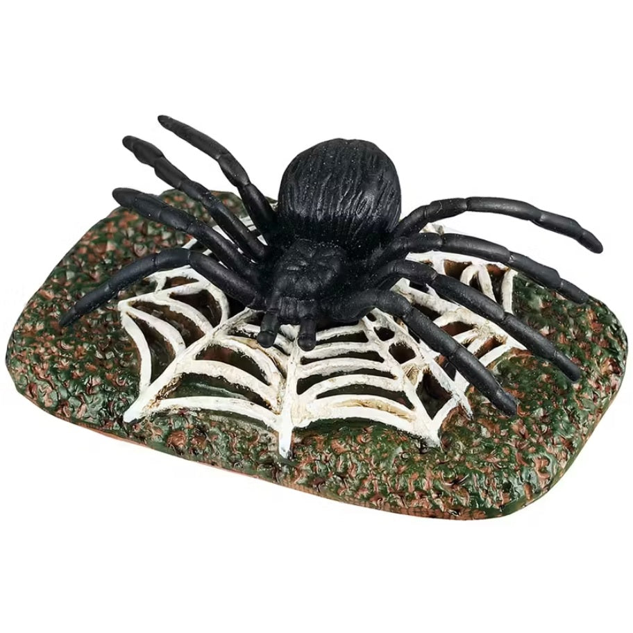 This is a Lemax Spooky Town accessory designed to look like a giant black spider yard decoration atop a giant white web.