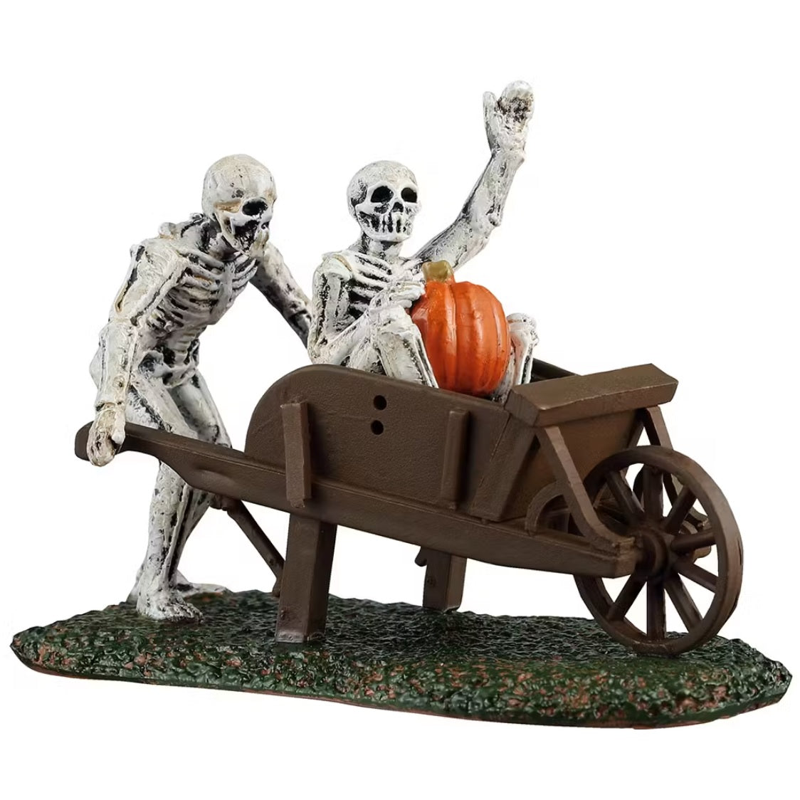 This is a Lemax Spooky Town figurine designed to look like a skeleton pushing a wooden garden cart with another skeleton inside. The skeleton in the cart is waving and holding a pumpkin.
