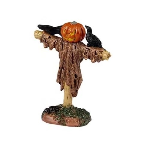 This is the scarecrow with the pumpkin for a head. He's wearing a ripped up, brown shroud and has two black crows resting on its arms. There's also a black tarantula at the base.