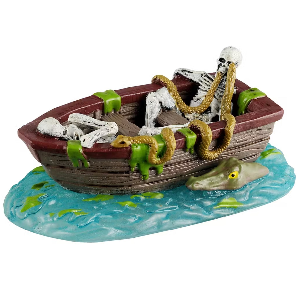 This is a Lemax Spooky Town piece that's designed to look like a brown, wooden boat floating on water. Inside the boat, there are two skeletons and lots of green slime. Coming out of one of the skeleton's eyes is a golden snake. Next to the boat in the water, you can see the top of an alligators head.