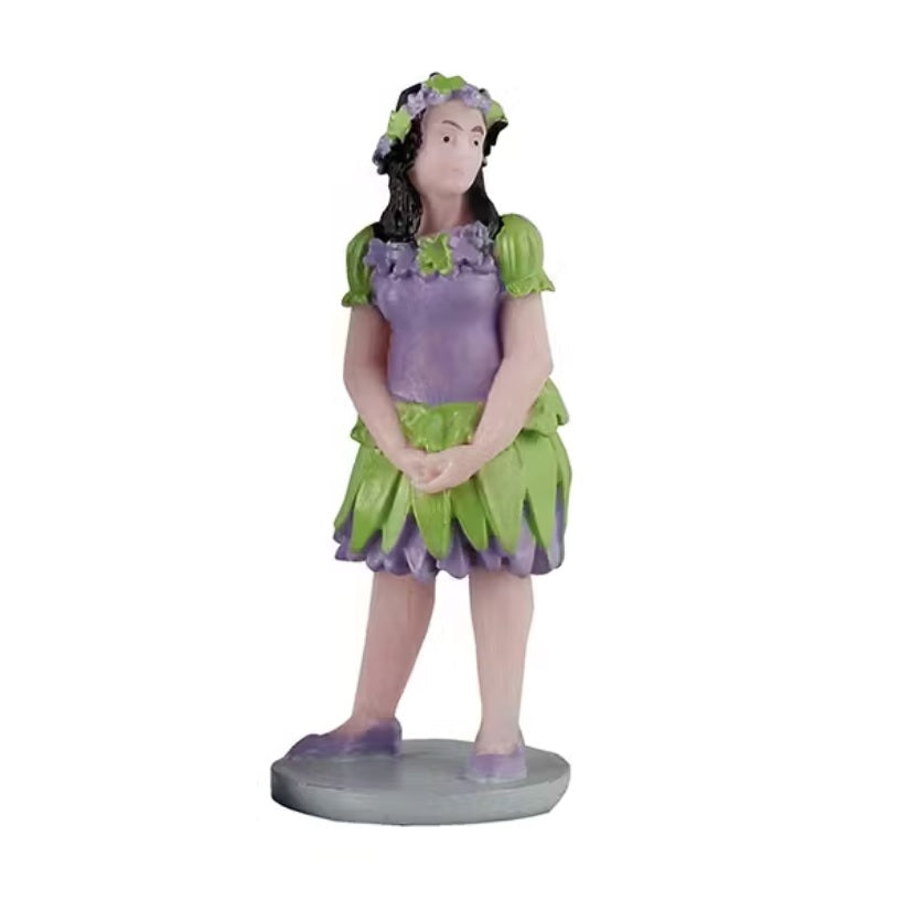 One of the kids is a girl dressed up like a fairy in a purple and green shirt/tutu combo. She's wearing a matching headpiece and shoes.