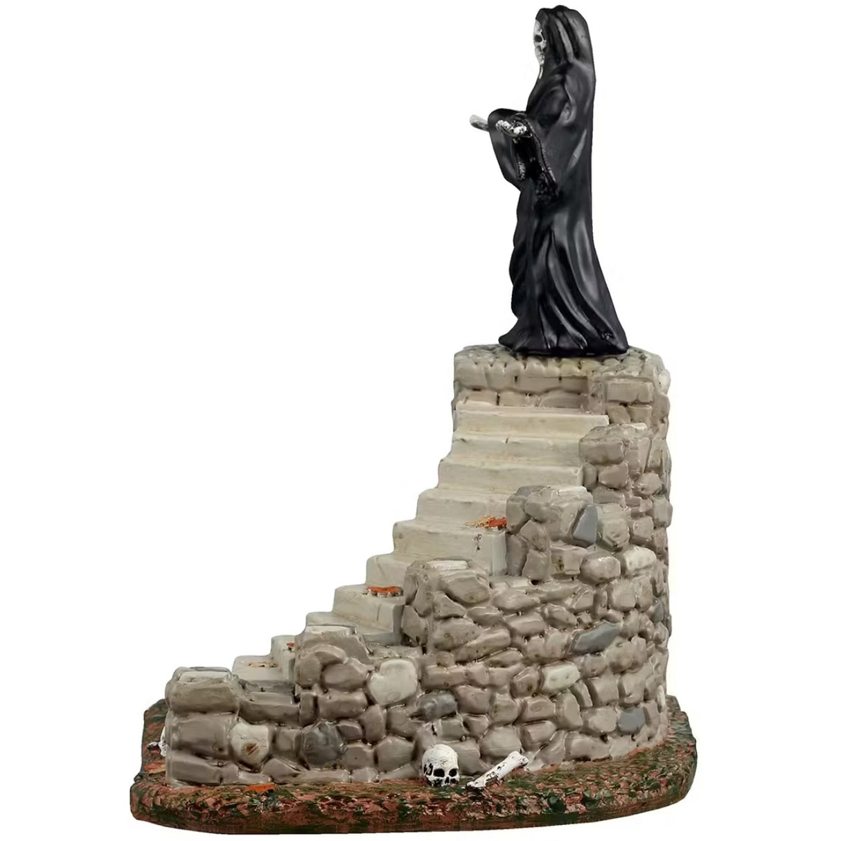 This is a different angle of the Lemax Spooky Town table accent that's designed to look like the Grim Reaper standing on top of a set of stone steps. There's an archway at the base of the stairs that has a bunch of skeletons and skulls inside.