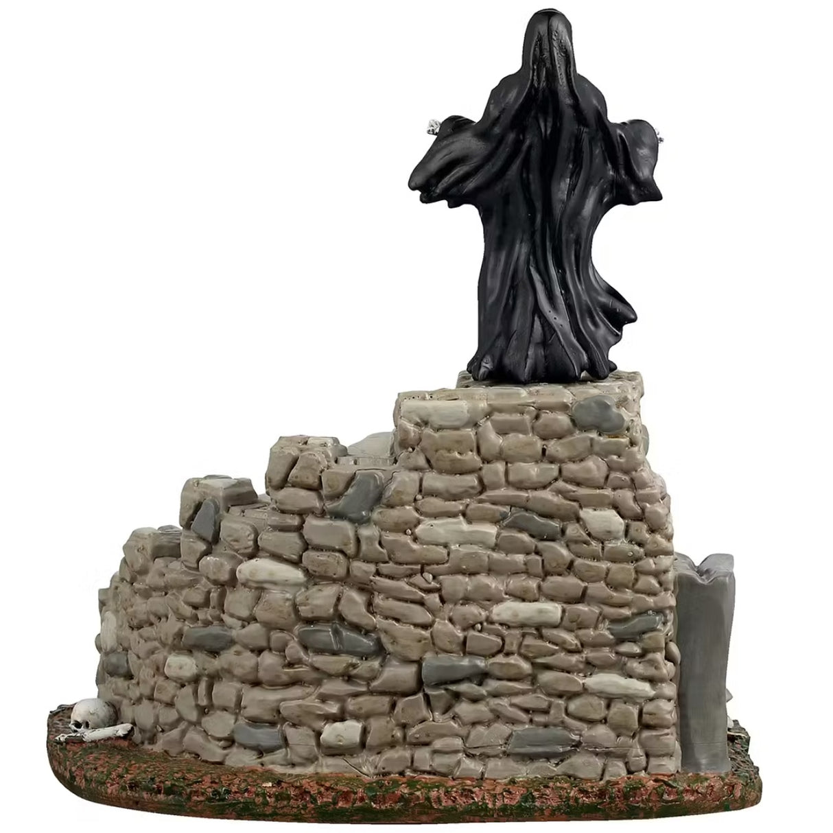 This is a different angle of the Lemax Spooky Town table accent that's designed to look like the Grim Reaper standing on top of a set of stone steps. There's an archway at the base of the stairs that has a bunch of skeletons and skulls inside.