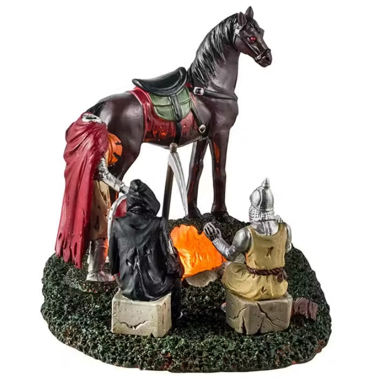 This is a different angle - This is a Lemax Spooky Town table piece that's designed to look like a knight, a Grim Reaper, the Headless Horseman and a horse standing around a campfire.