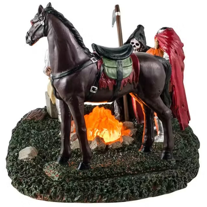 This is a different angle - This is a Lemax Spooky Town table piece that's designed to look like a knight, a Grim Reaper, the Headless Horseman and a horse standing around a campfire.