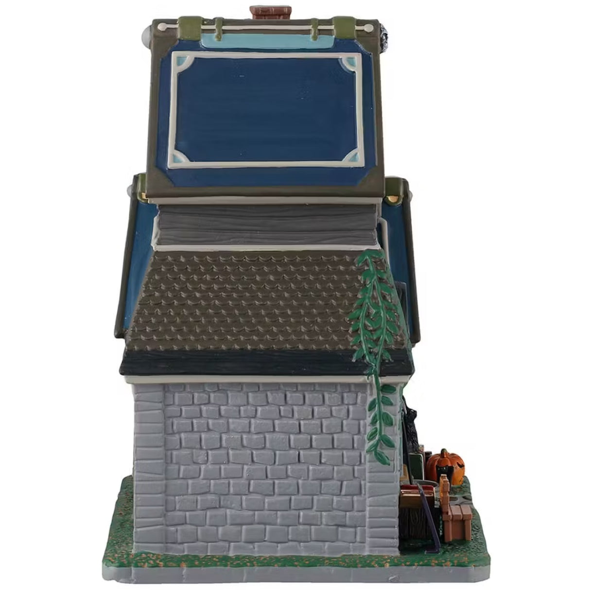 This is the other side of the building. There's ivy growing up the side and you can see a bench in front of the building.