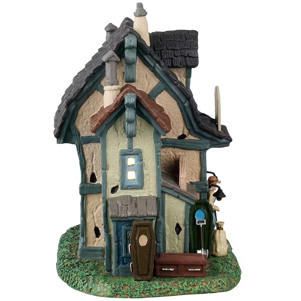 This is the side of the building. You can see light coming through the window and caskets piled up on the grass.