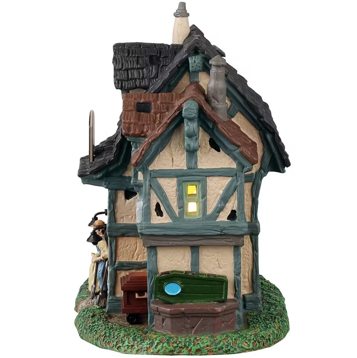 This is the other side of the building. You can see light coming through the window and there are caskets piled up on the grass.