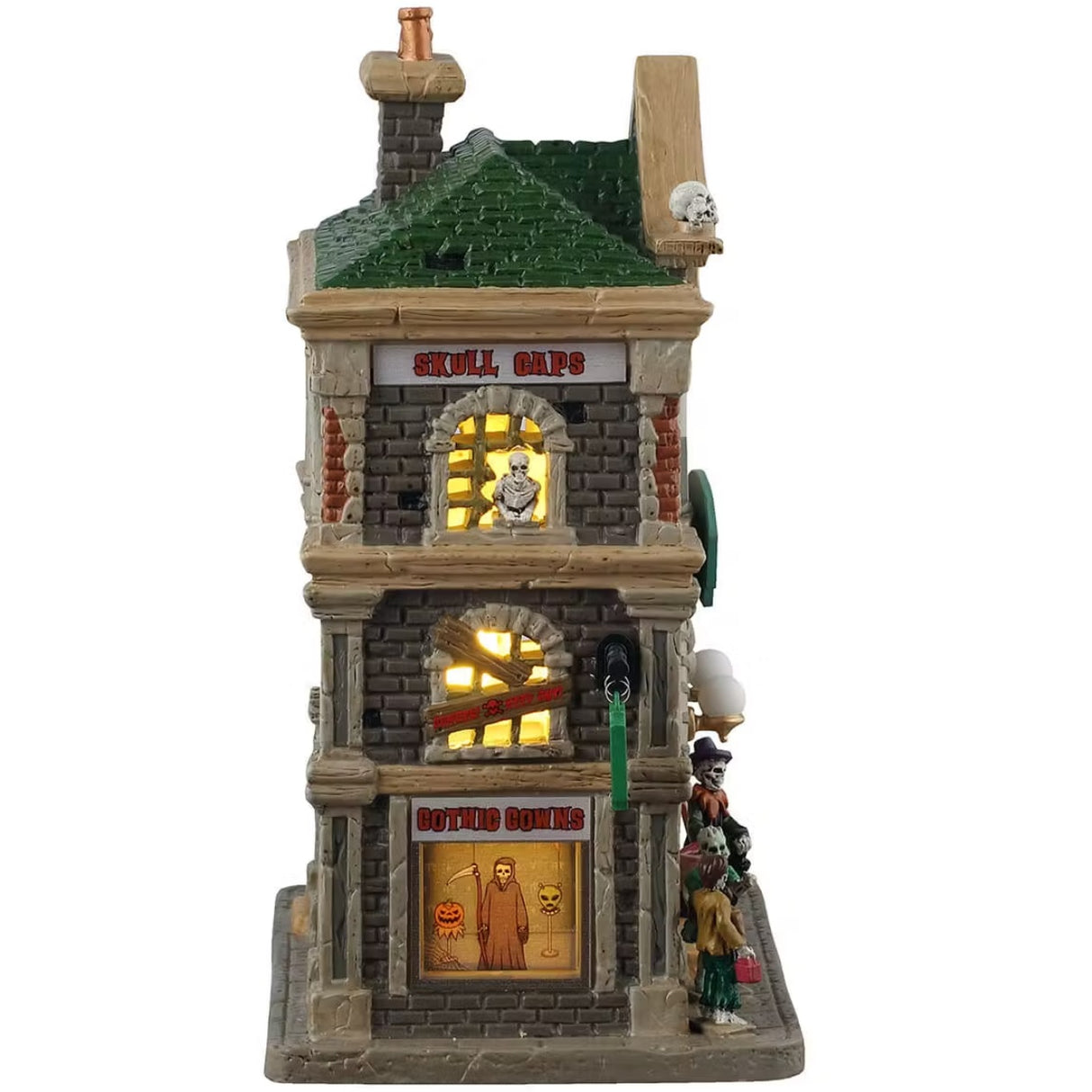 This is the other side of the building. There's a sign near the roof that reads "SKULL CAPS." There's a skeleton peeking out from the top window. The second window is boarded up and the bottom window is showcasing a jack-o-lantern mask, a grim reaper outfit and a spooky alien mask.