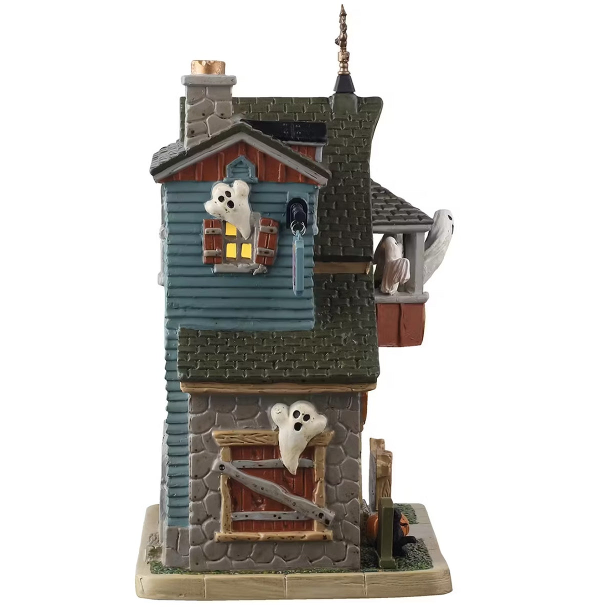 This is the side of this Lemax building. You can see a ghost flying out of the window on the top floor and a ghost flying near the sidewalk.