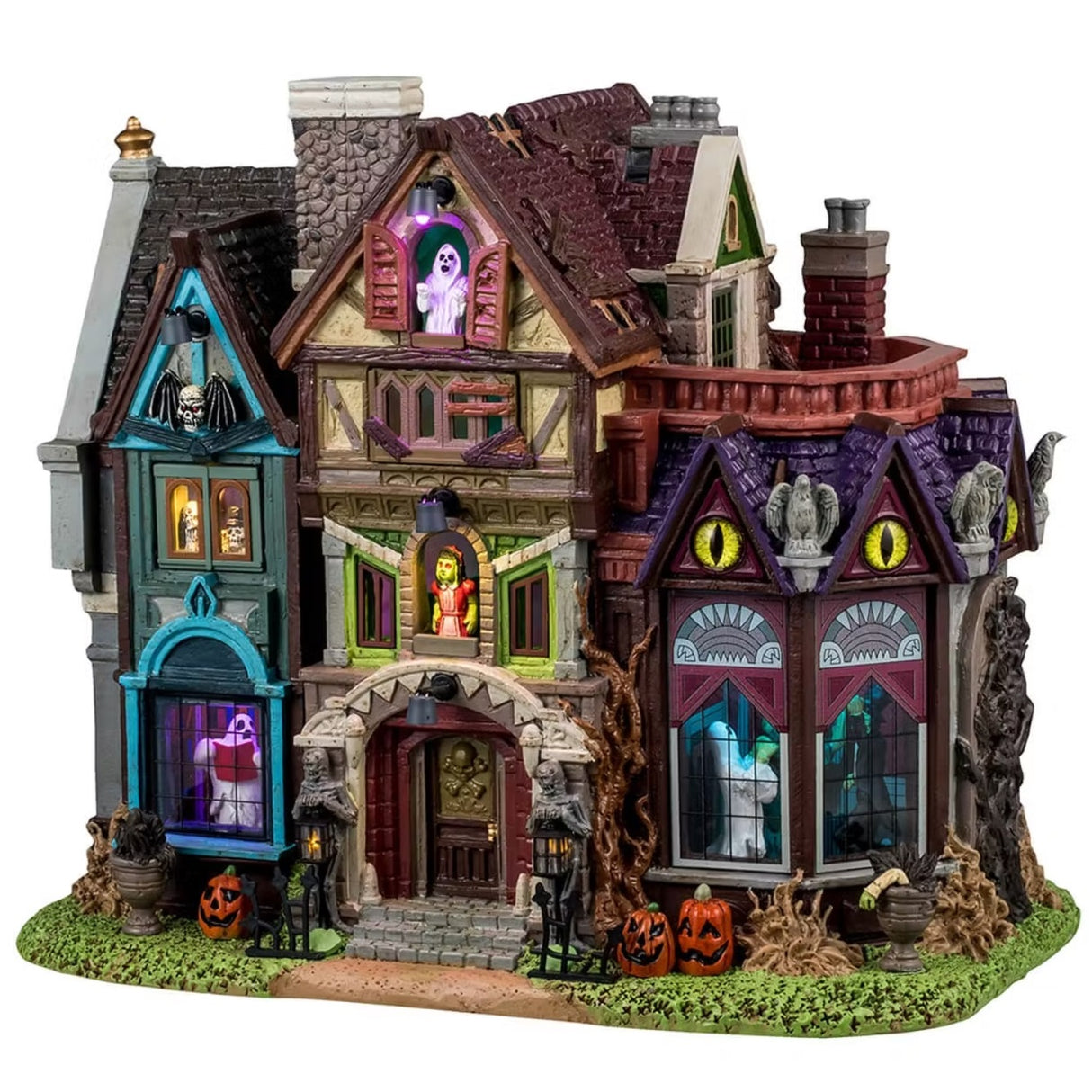 This is a Lemax Spooky Town lighted building that's designed to look like a slightly dilapidated and very colorful mansion. Some of the accents include: skulls, jack-o-lanterns, owl statues and dead plants. There are ghosts, monsters and skeletons visible in the windows.