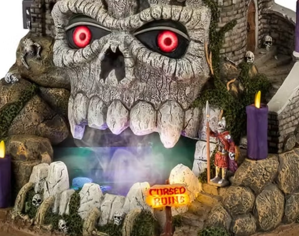 This is an up close view of the skull at the mouth of the cave. There's a sign that reads "Cursed Ruins."