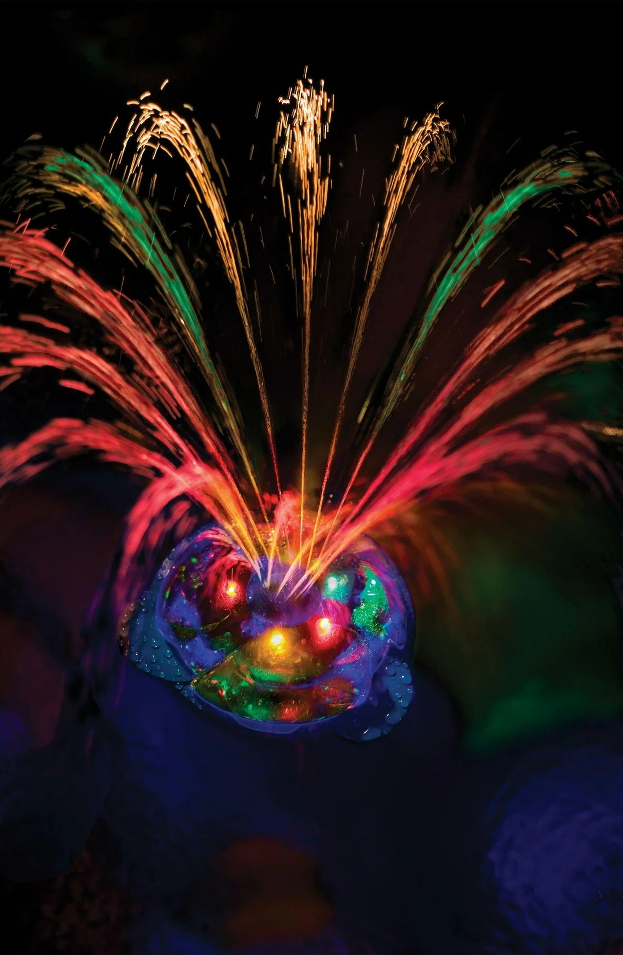 This is a lifestyle image showing the fountain and it's different lights.