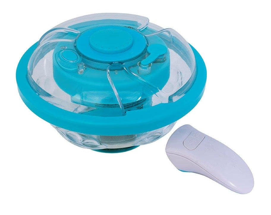 This image shows the plastic fountain/light show and remote on a white background.