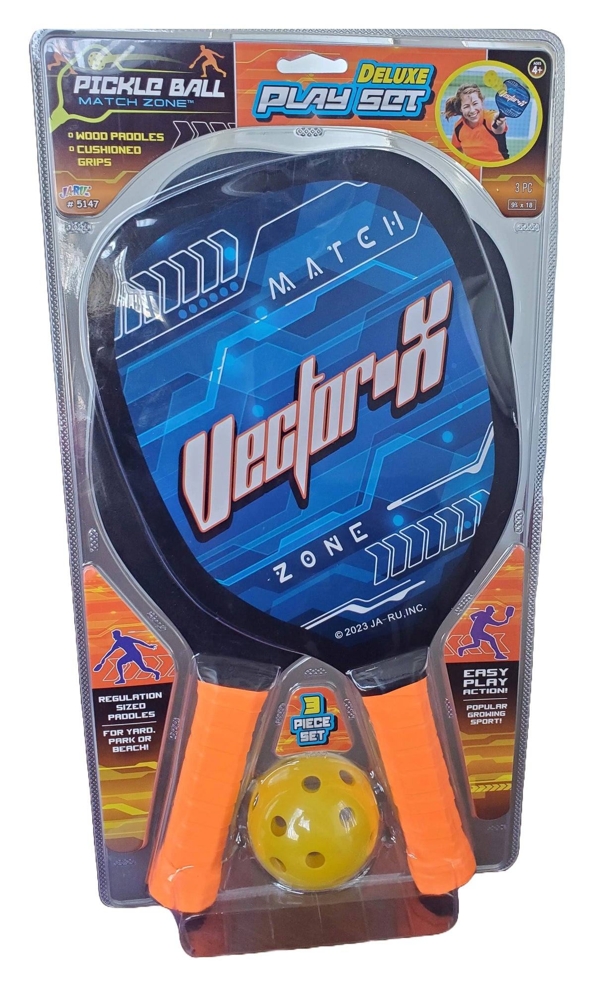 Pickleball deluxe play set. This image shows what the set looks like in its packaging. Set includes two blue wooden paddles with orange cushioned handles. The ball that is included is yellow.