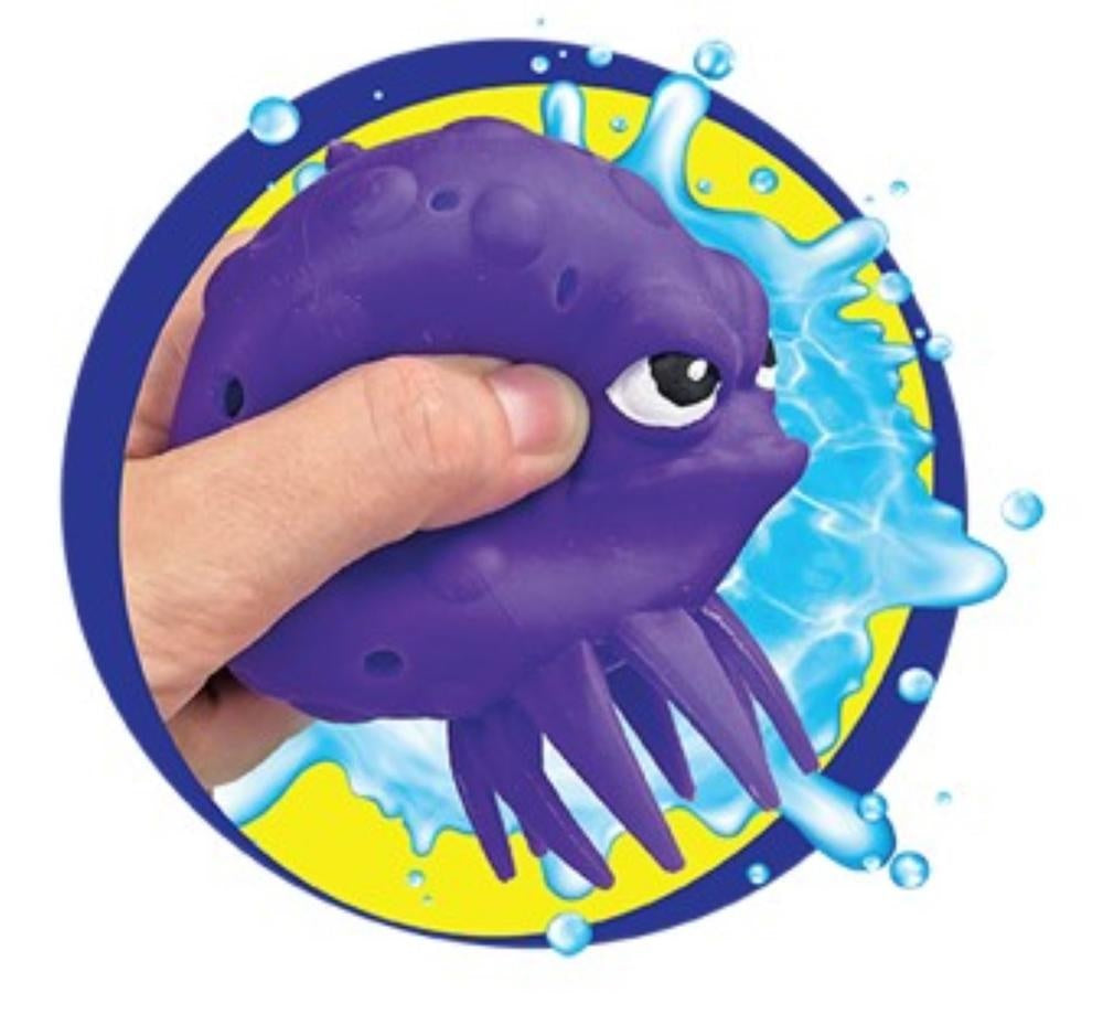 This image shows a hand squishing the purple octopus water ball.