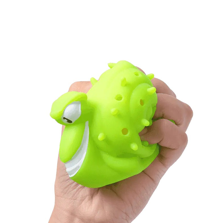 This image shows a hand squeezing the green snail ball.