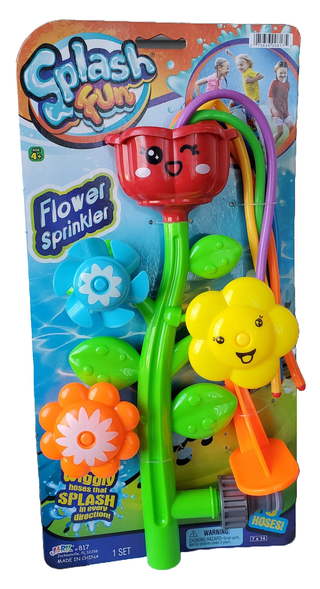 This is the packaging for a sprinkler shaped like a stem with four "petals." The top flower has five wiggly hoses coming out of it. The other flowers spin to shoot the water in different directions. The flower colors in this image are red, orange, yellow and blue.