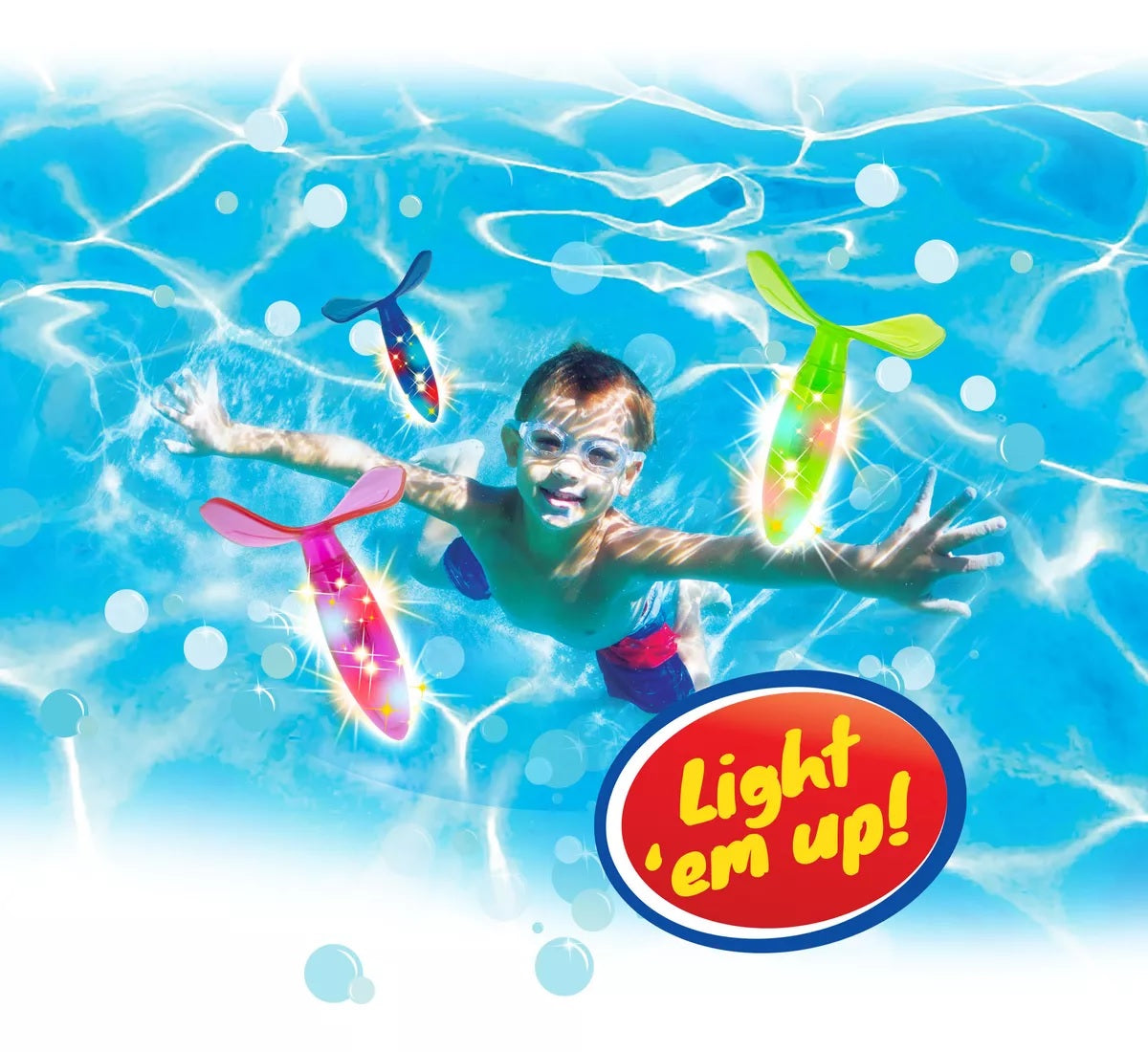 This picture shows a little boy underwater reaching for the diving toys.