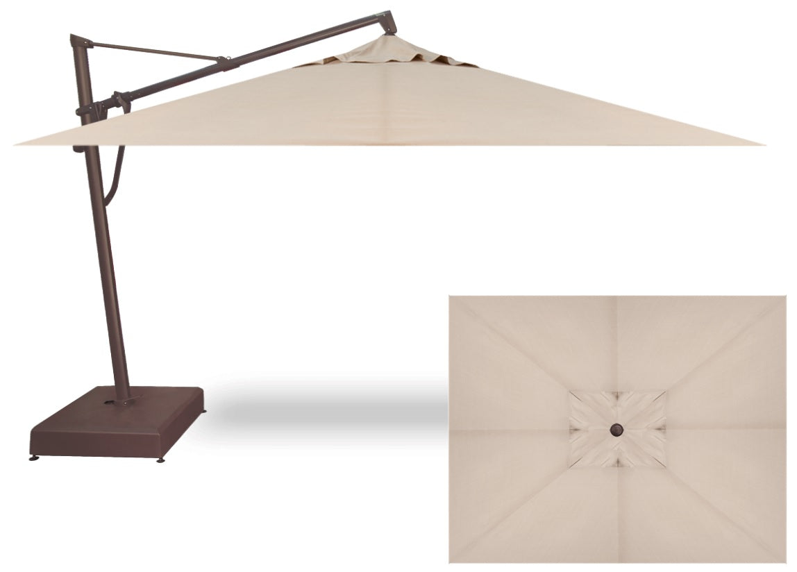 Rectangular cantilever umbrella. The frame and base is bronze and the umbrella's fabric is a champagne/tan color.
