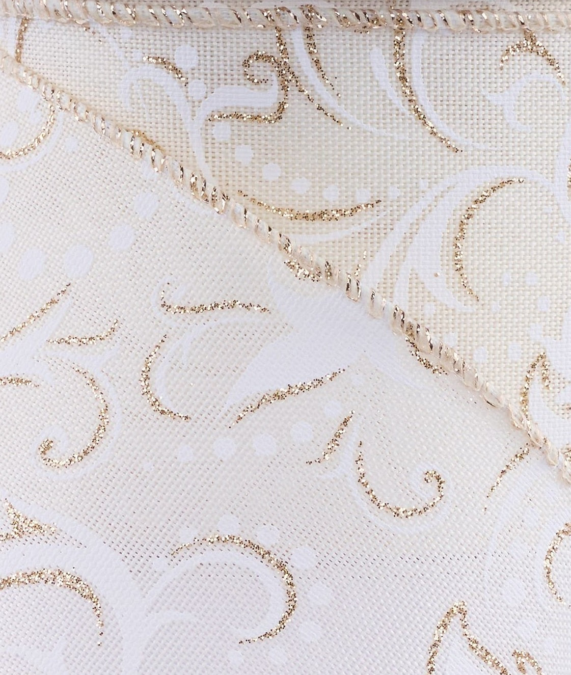 This is an up close view of the shimmering champagne leaf swirl print design.