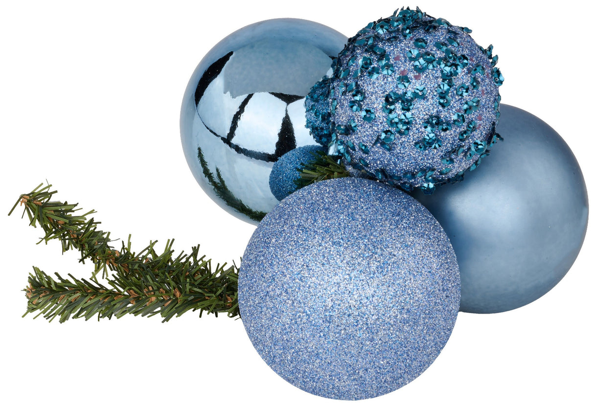 This image shows the smoke blue bauble cluster with a pine branch. One bauble is a shiny smoke blue color. One bauble is decorated with smoke blue tinsel. One bauble is decorated with smoke blue glitter. One bauble is a matte smoke blue color.
