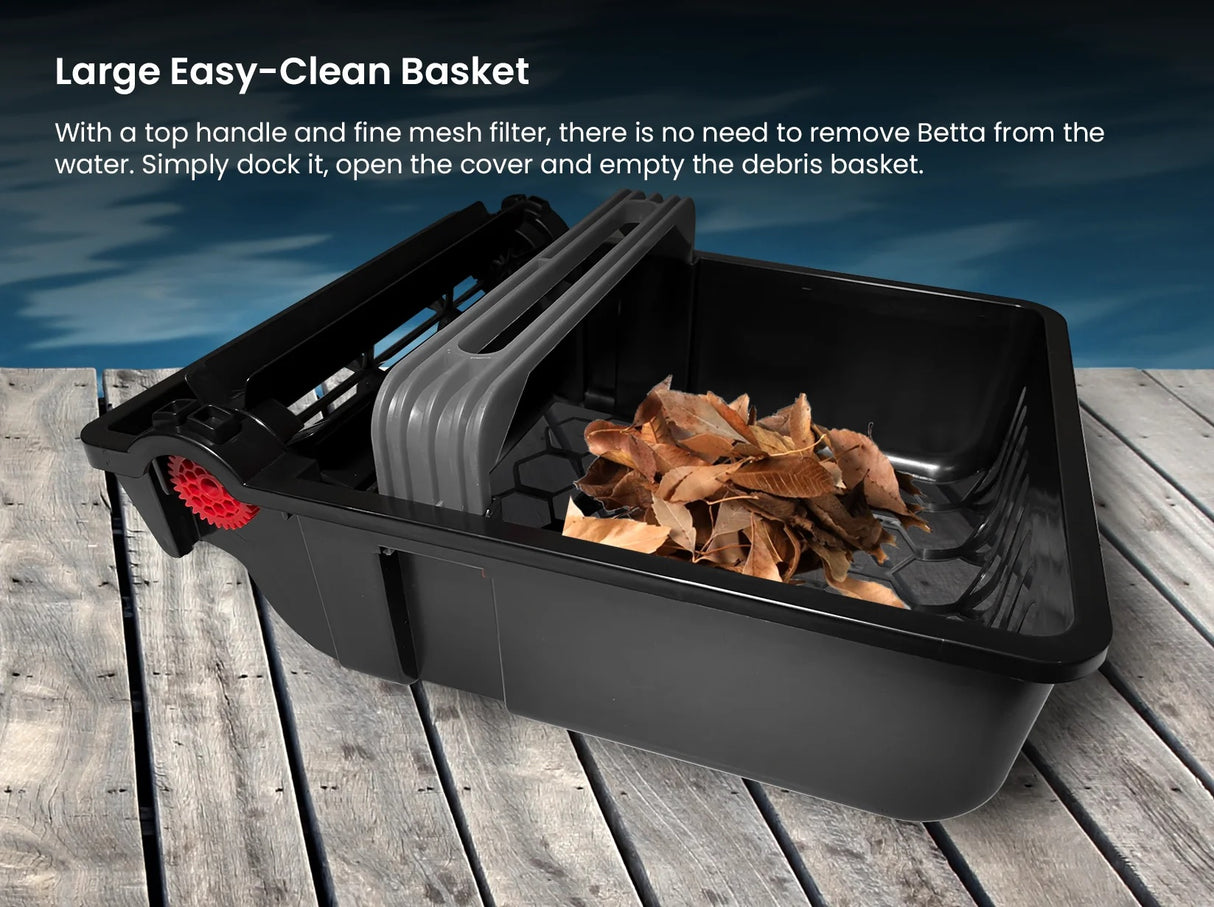 This image shows the basket of the pool cleaner full of leaves on a wooden deck next to a pool. It reads "Large Easy-Clean Basket. With a top handle and a fine mesh filter, there is no need to remove Betta from the water. Simply dock it, open the cover and empty the debris basket."